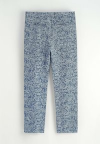 Leggings à motif floral bleu, fabriquées en tissu doux, présentant un design ajusté avec une taille élastique pour plus de confort.