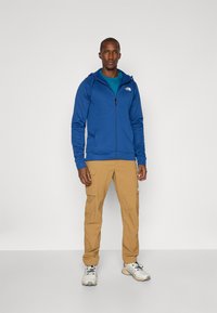 The North Face REAXION HOODED FULL ZIP JACKET - Trainingsvest - estate blue/dark heather