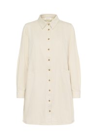 Gombos ruha krémszínű anyagból, gallérral, hosszú ujjakkal, elülső zsebekkel és egyenes szabással, aranyszínű gombokkal.