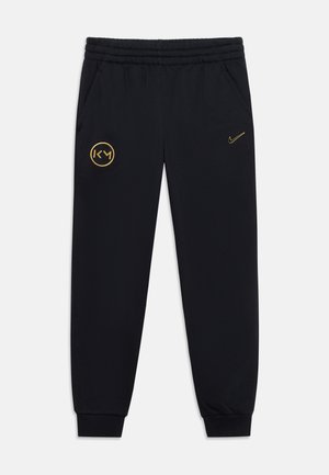 Nike Performance, KYLIAN MBAPPE CLUB UNISEX - Tracksuit bottoms - black/gold-coloured