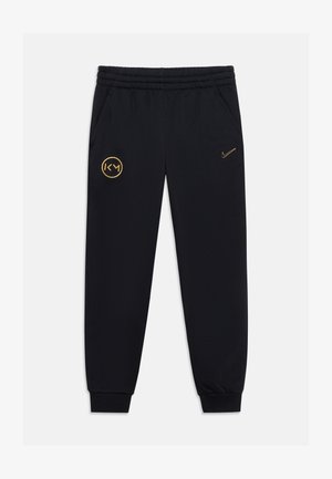 Nike Performance, KYLIAN MBAPPE CLUB UNISEX - Tracksuit bottoms - black/gold-coloured