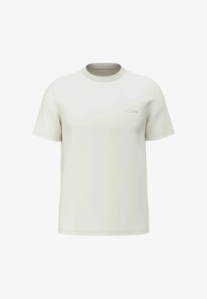 T-shirt beige chiaro a maniche corte con scollo a girocollo, piccolo logo "GUESS" sul petto a sinistra, design semplice e orli cuciti.