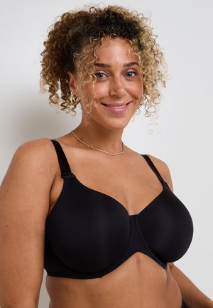 Reggiseno nero con coppe preformate, spalline regolabili e texture liscia. Presenta una cucitura al centro e una chiusura con ganci e occhielli.