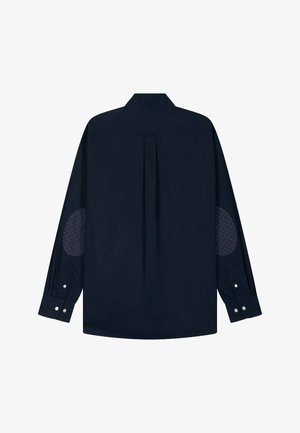 Chemise à manches longues bleu marine avec un pli au dos, des coudières à motifs, des poignets à boutons et un col classique. Texture du tissu lisse.