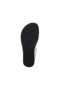 Black rubber sole with textured grip pattern and rounded shape; light-colored sides and heel, minimalistic design without embellishments.
