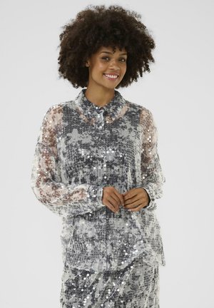Sheer long-sleeve shirt in grey with sequins and a pleated texture. Features a classic collar and button closure, paired with matching skirt.