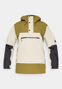 Huppari, jossa on huppu ja kaksivärinen muotoilu oliivinvihreänä, kermanvalkoisena ja mustana. Takissa on etutasku vetoketjulla ja napit.