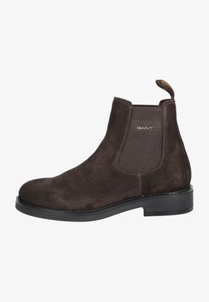 Brown suede Chelsea boot with elastic side panels, rounded toe, and a low black rubber sole. Features brand logo on the pull tab.