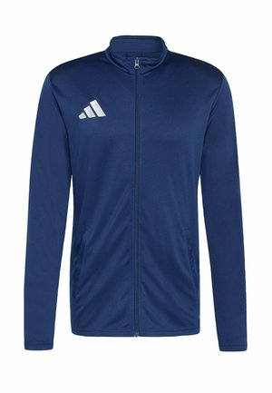Marineblaue Zip-up-Jacke aus glattem Stoff. Merkmale einen hohen Kragen, zwei seitliche Taschen und ein weißes Logo mit drei Streifen auf der Brust.