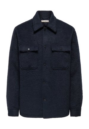 Laivastonsininen villasekoiteinen paitatakki, jossa on teksturoidu pinta, nepparit, kaksi rintataskua ja terävä kaulus.