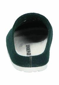Green felt slipper with a rounded back, white outsole, and soft interior lining. Features stitching along the upper edge.