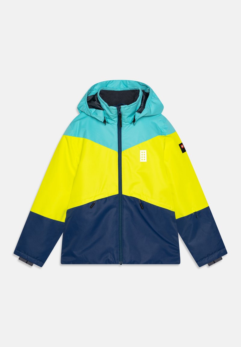 Színes kapucnis dzseki türkiz, sárga és sötétkék színblokkolású dizájnnal. Könnyű, vízlepergető anyagból készült.