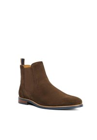 Bottines chelsea en daim marron avec une surface lisse, des panneaux latéraux élastiques, une languette de tirage et une semelle en cuir. Présente un bout arrondi.
