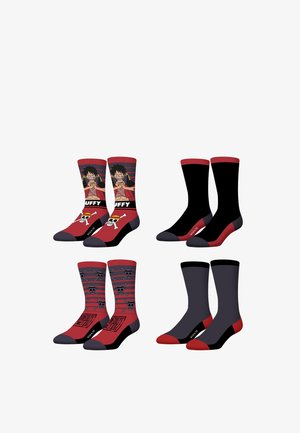 Quatre paires de chaussettes montantes en rouge et noir, deux paires arborent des motifs de crâne et un personnage portant un gilet rouge, deux paires sont de couleur unie.