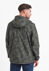 Camo-patterned jacket in shades of dark green and gray. Hooded design with elastic cuffs, featuring a lightweight, textured fabric.