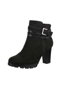 Botines de ante negros con tacón alto de bloque, que cuentan con correas decorativas y una banda texturizada. La suela tiene un patrón de banda de rodadura resistente.