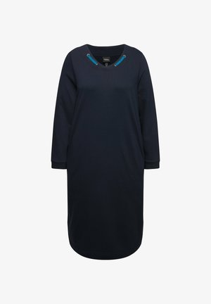 Vestido azul marino con corte holgado, escote redondo y mangas tres cuartos. Presenta acentos de ojal turquesa en el escote.