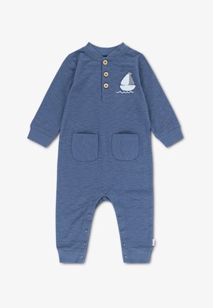 Combinaison en coton bleu à manches longues, avec trois boutons au niveau du col, deux poches frontales, et un détail brodé représentant un voilier.