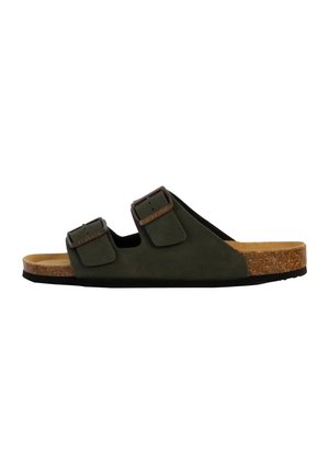 Sandale à enfiler vert foncé avec deux boucles ajustables et une semelle en liège, vue de profil sur fond blanc.