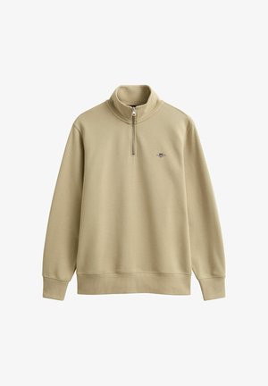 Beige pullover met lange mouwen, een kwart ritssluiting en een klein geborduurd logo op de linkerborst, voorzien van geribbelde manchetten en zoom.