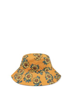 Chapeau seau en tissu jaune moutarde avec un motif de tournesols, centres marron et feuilles vertes. Large bord et design structuré.
