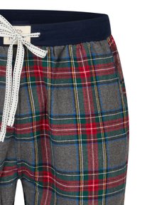 Grijze geruite loungebroek met rode, groene en gele strepen. Voorzien van een marineblauwe elastische tailleband en een wit trekkoord met zwarte accenten.