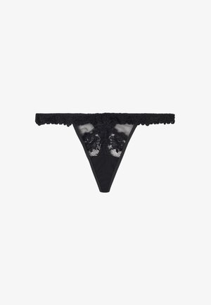 Black lace thong with floral patterns and mesh detailing, featuring a scalloped lace waistband.