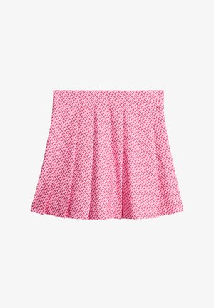 Uppskuren kjol i klar rosa tyg med ett geometriskt vitt mönster, som har en slät textur och elastisk midja för bekvämlighet.