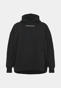 Sudadera con capucha negra hecha de una mezcla de algodón. Presenta un ajuste relajado, mangas largas y el logo blanco "CALVIN KLEIN JEANS" en el pecho.