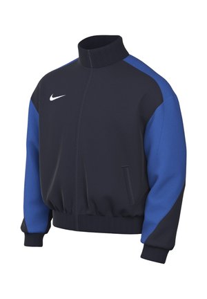 Giacca sportiva Nike nera e blu con collo alto, polsini e orlo a coste e logo Nike bianco sul petto sinistro.