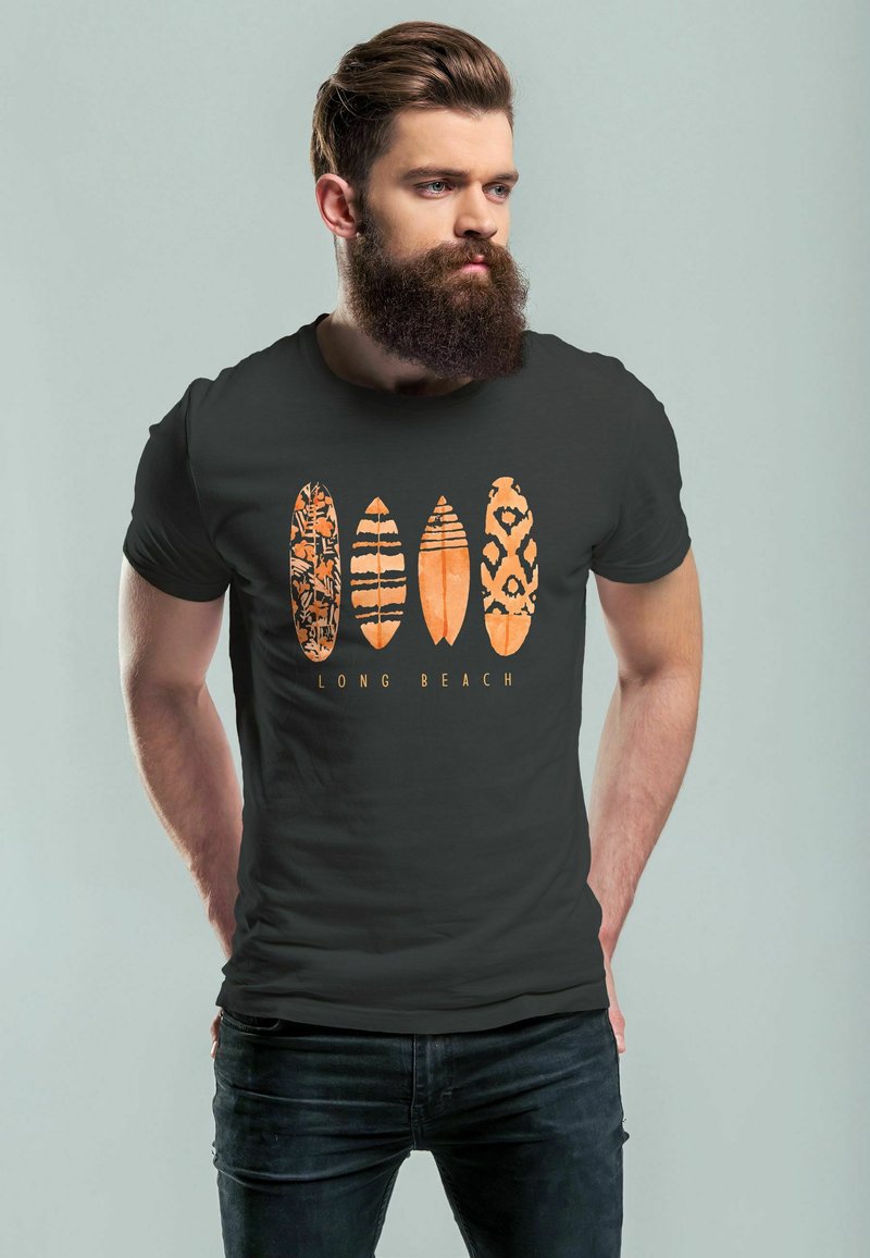 Black t-shirt featuring five surfboard designs in orange with various patterns, including stripes and spots, and the text "LONG BEACH" below.