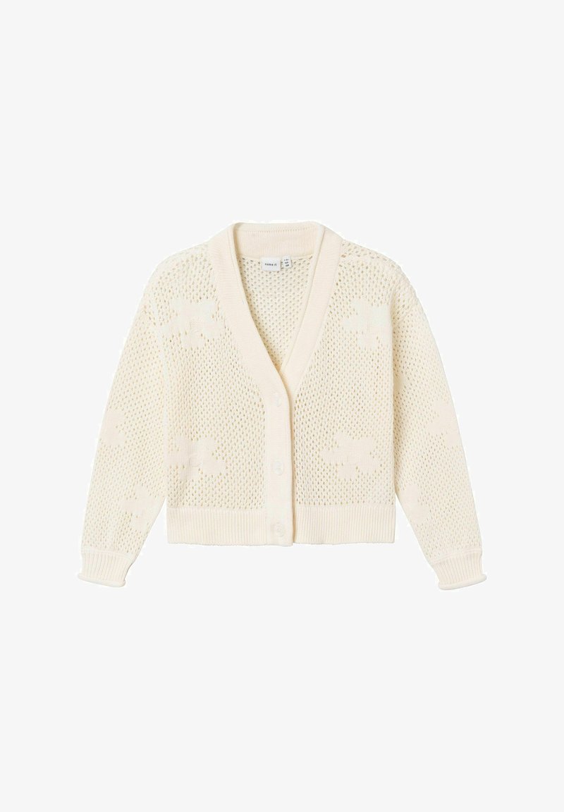 Cardigan en maille couleur crème avec manches longues, boutonné sur le devant, motif ajouré et motifs floraux discrets.