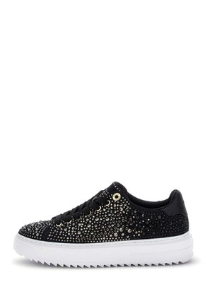Black low-top sneaker with black laces, covered in small shiny rhinestones, and a thick white jagged sole.