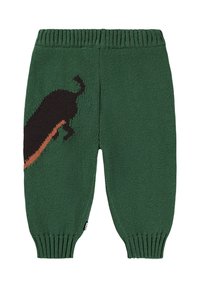 Pantalons tricotés verts avec un design en silhouette de teckel noir et orange. La taille et les poignets côtelés ajoutent de la texture et un bon ajustement.