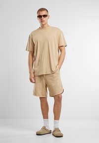 Urban Classics WASHED PIPED - Pantalon de survêtement - unionbeige