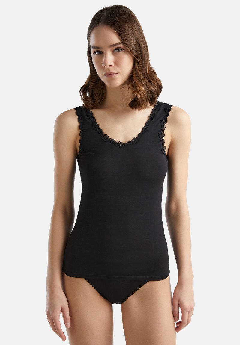 Black tank top made of soft fabric, featuring a scalloped lace trim along the neckline and straps, with smooth, fitted construction.