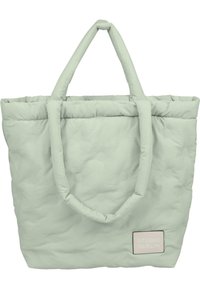 Lys grøn puf tote bag med to håndtag, tekstureret overflade med forhøjede prikker og et syet mærke med "STUDIO BERLIN" i pastelfarver.