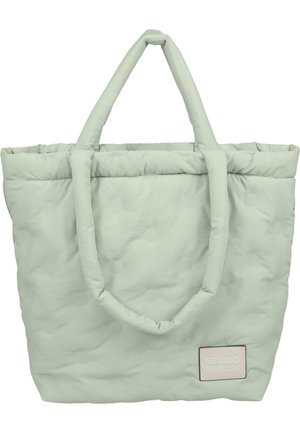Borsa tote puffy verde chiaro con due manici, superficie testurizzata con punti in rilievo e un'etichetta cucita con "STUDIO BERLIN" in tonalità pastello.