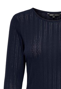 Navyblauw long sleeve top met een geribbelde textuur en decoratieve patronen. Heeft een ronde halslijn en een getailleerd ontwerp.