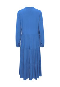 Rochie din bumbac albastru, cu mâneci lungi, design în straturi și guler înalt. Prezintă detalii pliate la manșete și o siluetă fluidă.