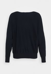 Black knitted sweater with a rounded neckline, long sleeves, and ribbed hem, featuring a smooth texture and relaxed fit.