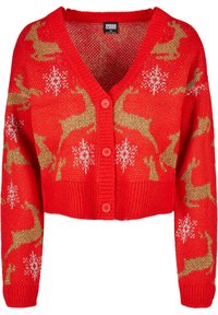 Röd kort cardigan med V-ringning, prydd med guldrenar och vita snöflingemönster, stickad textur och framknappar.