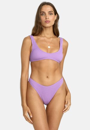 Purple textured bikini with a scoop neck top and high-waisted bottom. Features wide straps and a seamless design. Soft fabric texture.