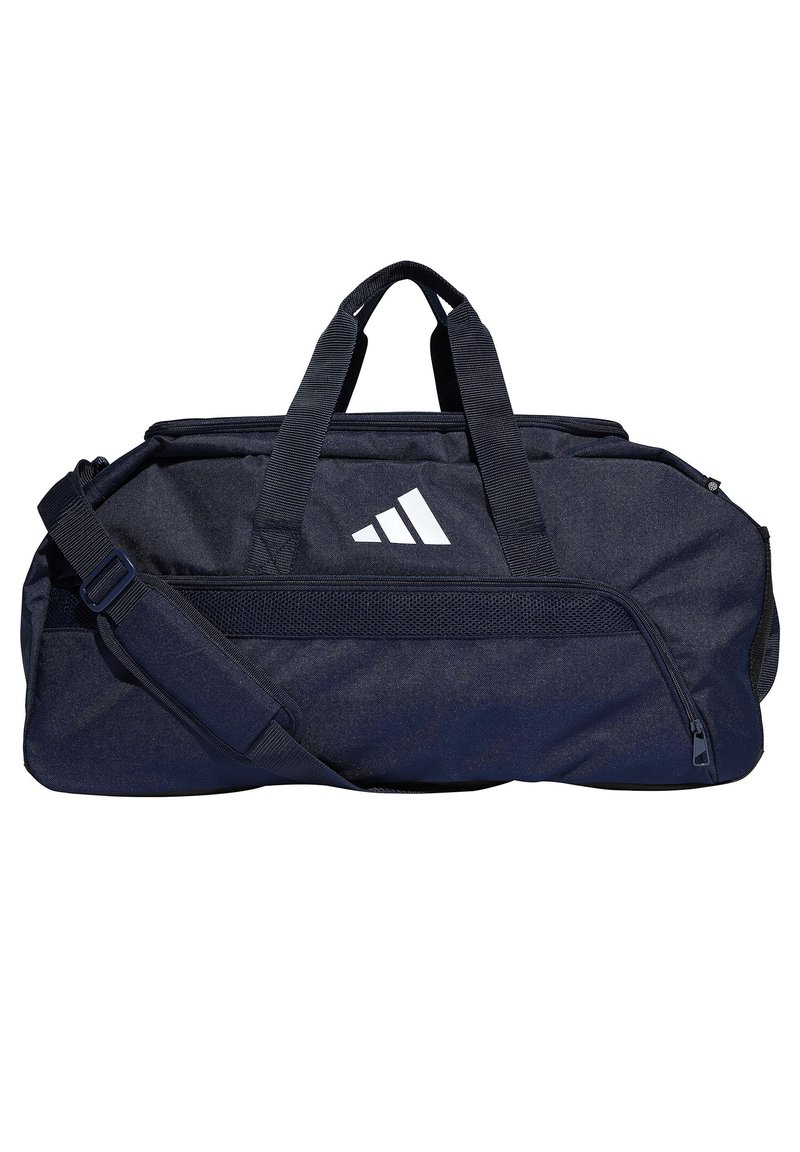 Navy duffelbag met twee handgrepen en een afneembare schouderriem. Bevat een rits hoofdcompartiment en witte logo-details. Gladde textuur.