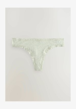 Thong cu Lace, realizat dintr-un material verde deschis cu un model cu puncte; prezintă margini ondulate și o textură netedă.