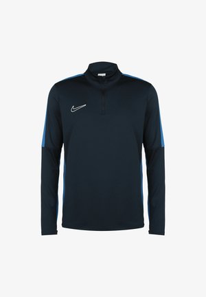 Haut de sport Nike bleu marine à manches longues avec fermeture éclair au quart et rayures bleu clair le long des manches et des côtés.