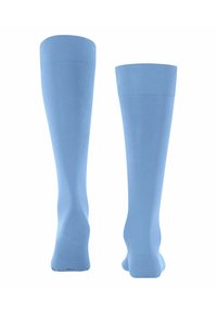 Calzini al ginocchio azzurro chiaro realizzati in materiale liscio ed elastico, con polsini a coste e design della punta senza cuciture.