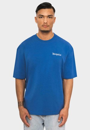 Blue cotton oversized t-shirt featuring a crew neckline, short sleeves, and white "Dropsize" text on the left chest.