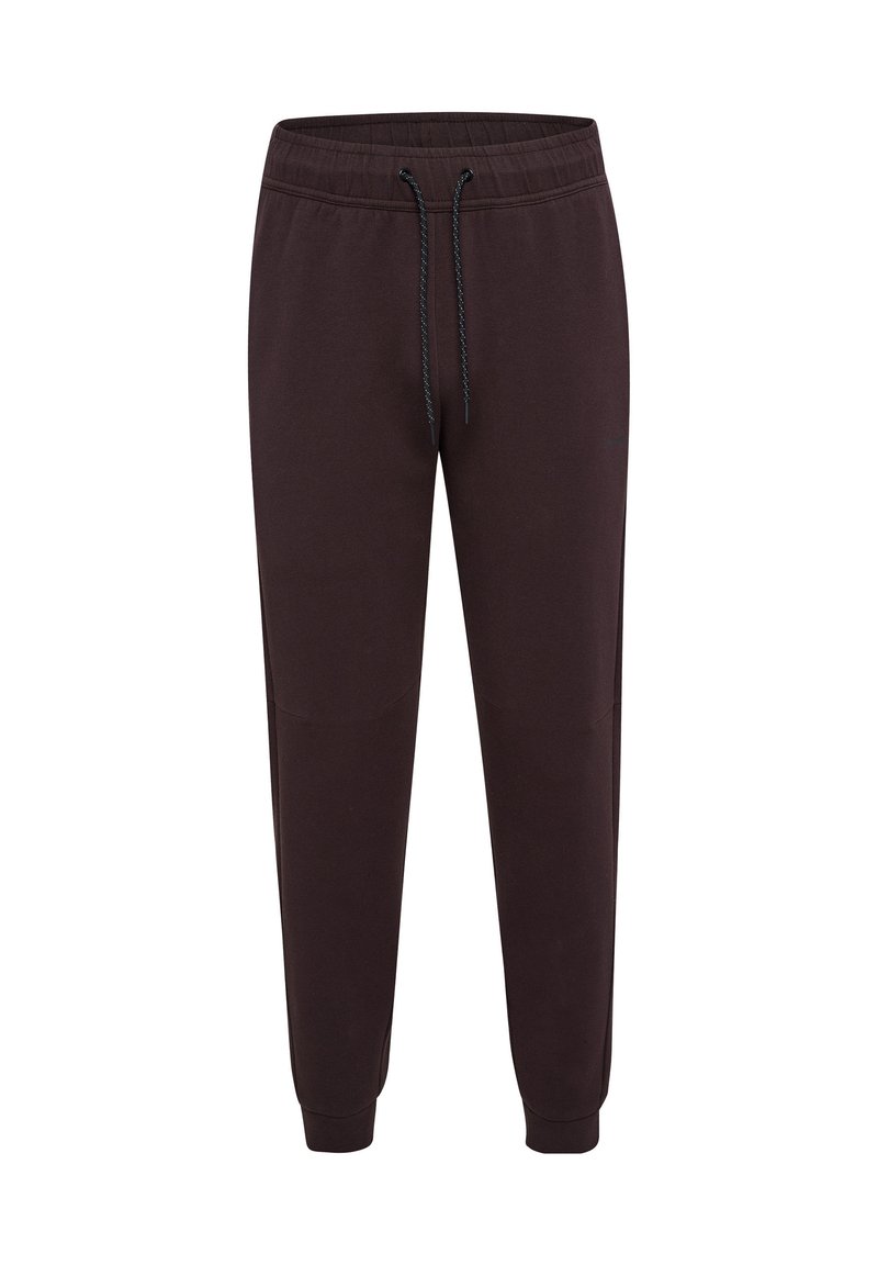 Mörkbruna sweatpants med elastisk midja, dragsko-detalj, sidofickor och smalnande ben. Tillverkade av mjukt tyg med en slät textur.