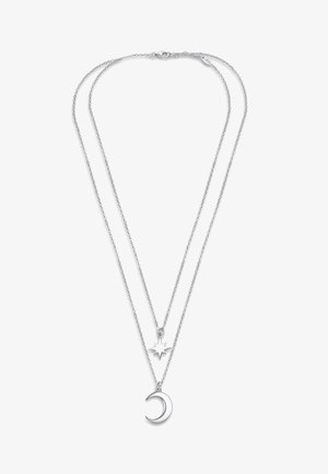Collier en argent avec deux chaînes superposées. La chaîne supérieure présente un pendentif en forme d'étoile, tandis que la chaîne inférieure affiche un pendentif en forme de croissant de lune.